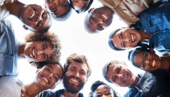 Team of pharmaceutical and healthcare market researchers & analytics professionals smiling together